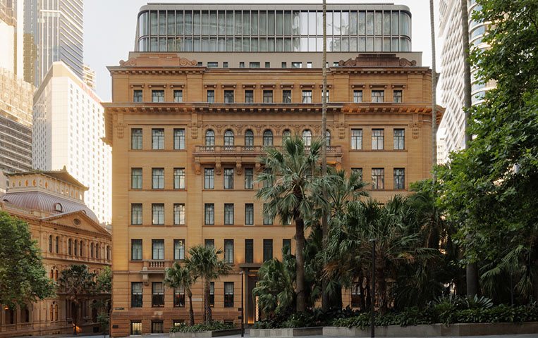 The heritage sandstone facade of Capella Sydney on Bridge Street