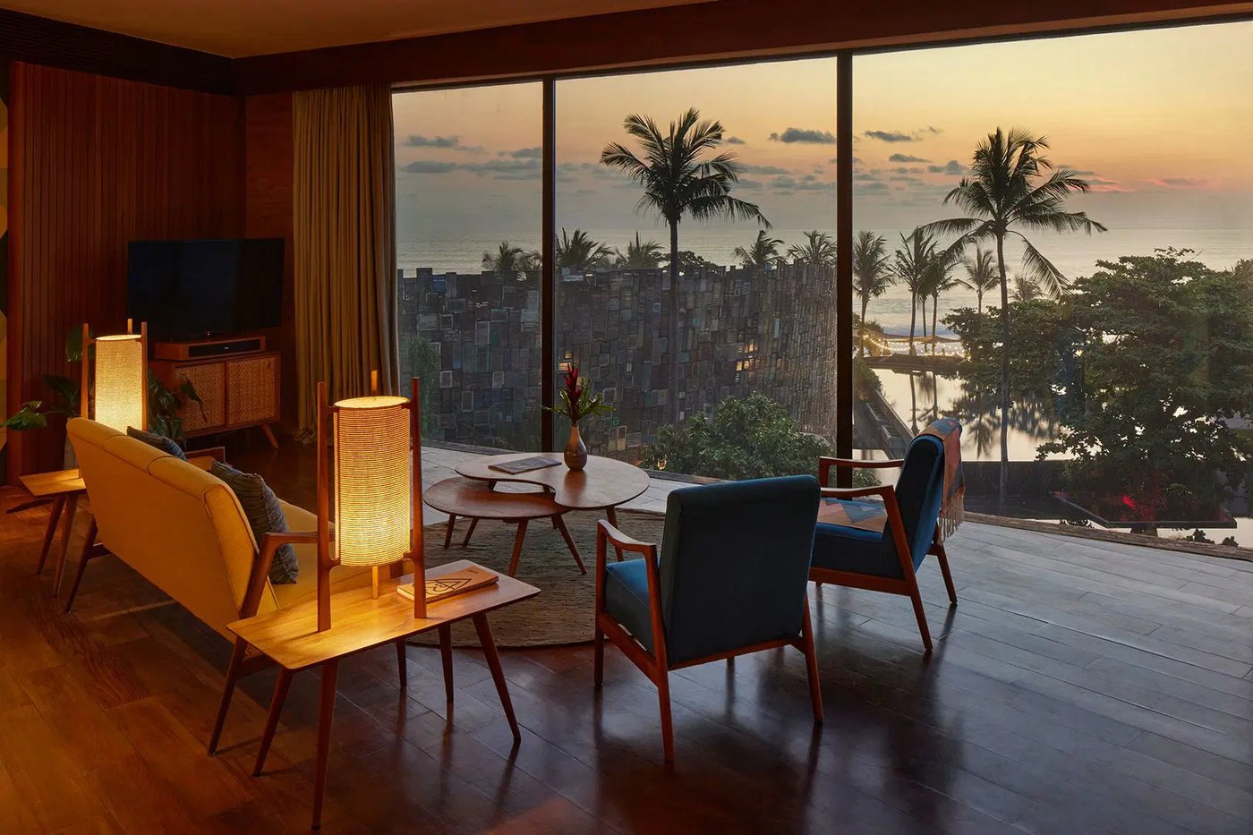 A timber-lined AM House room at Desa Potato Head, Seminyak, opening to the ocean