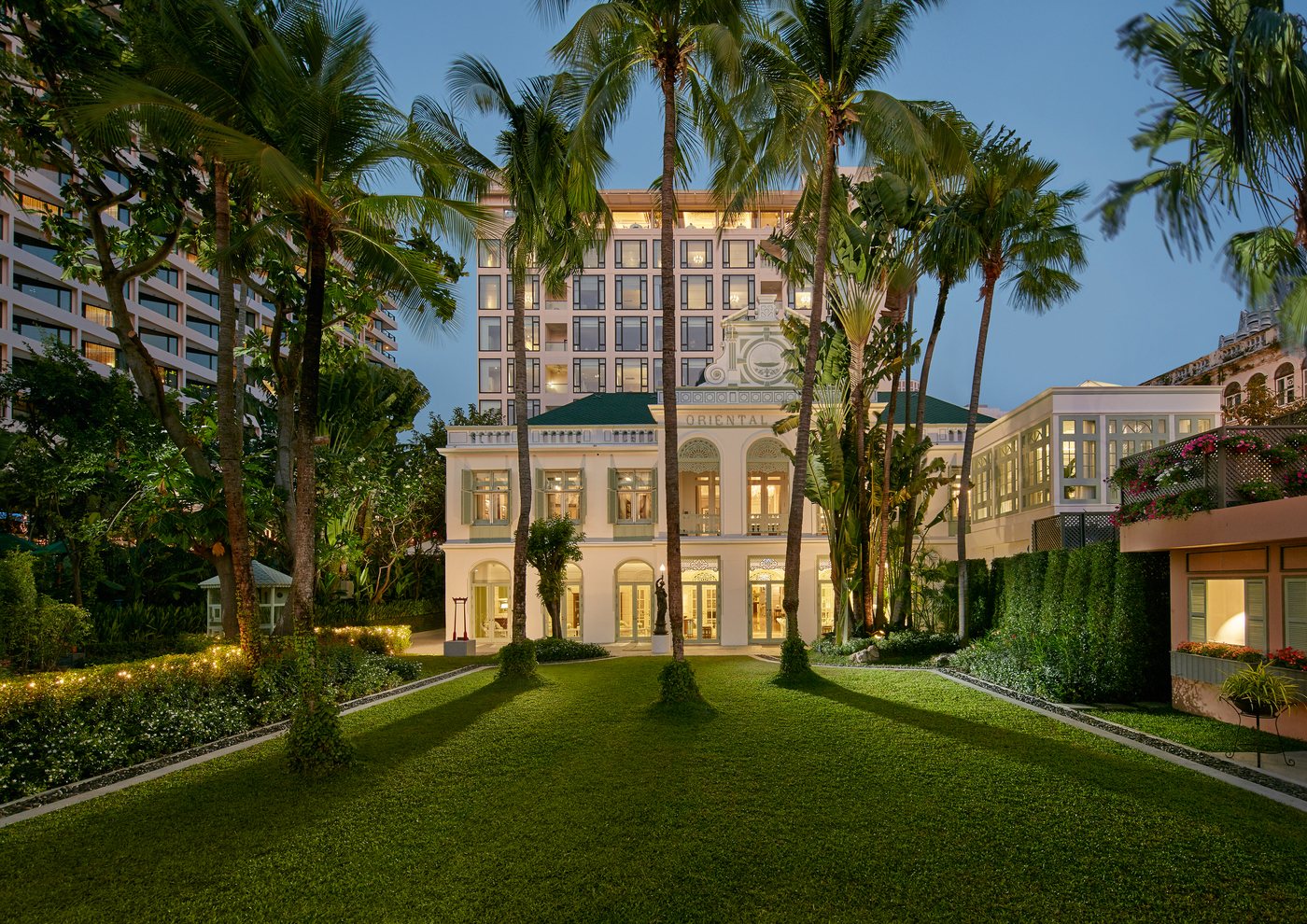 The garden facade of Mandarin Oriental Bangkok at dusk