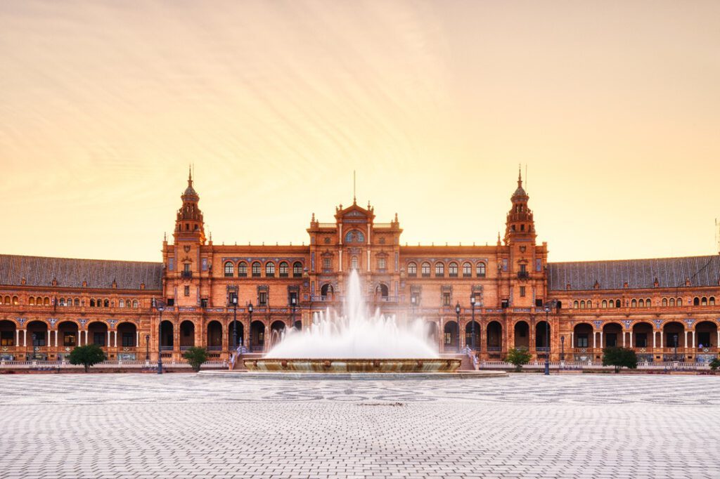 The curved brick arcades and canal of the Plaza de España, Seville