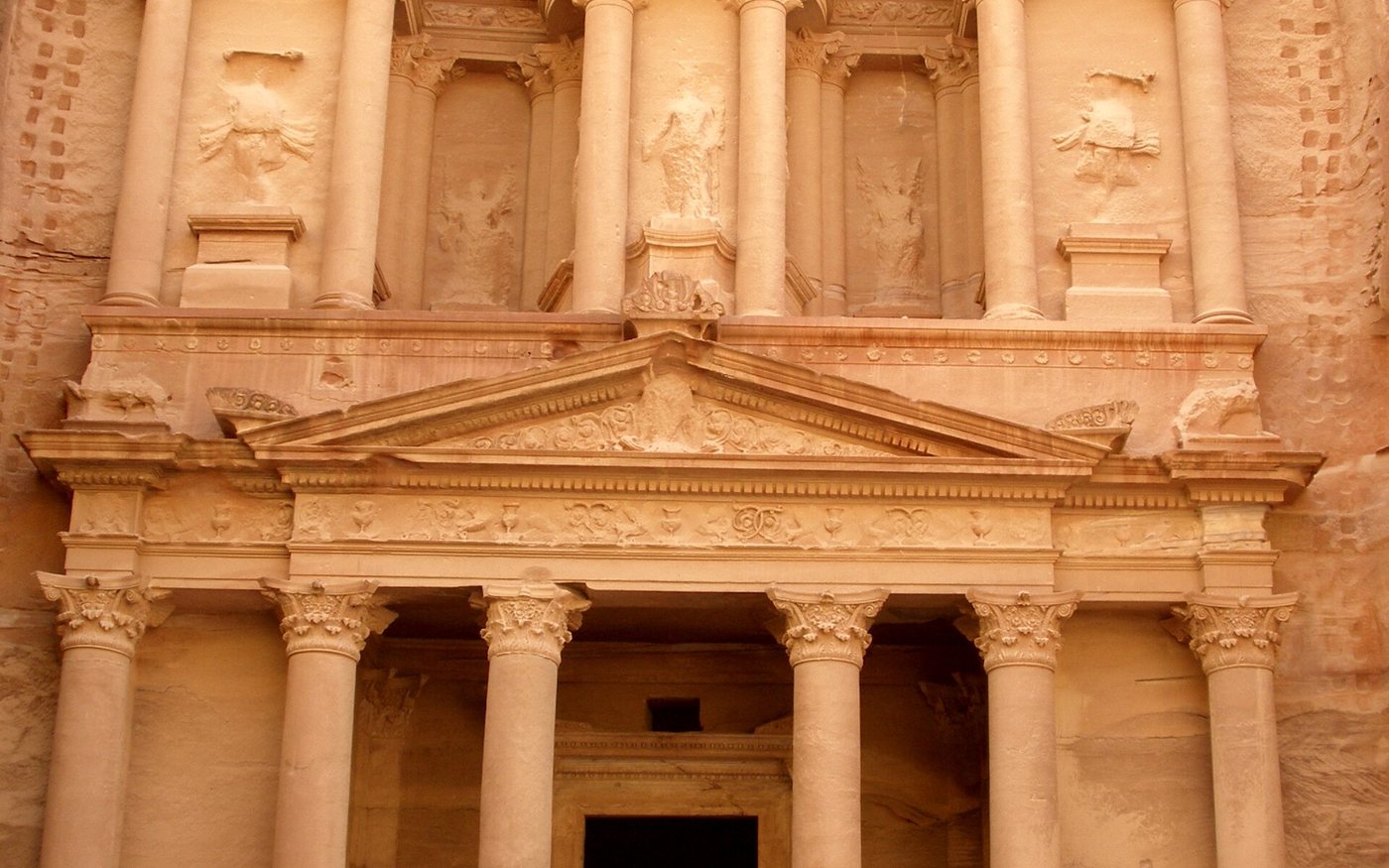 Al-Khazneh, the Treasury, carved into rose-coloured rock at Petra